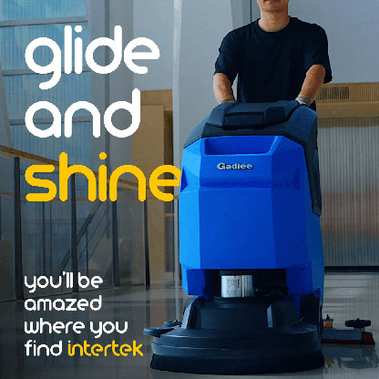 A man pushing a Gadlee floor cleaner