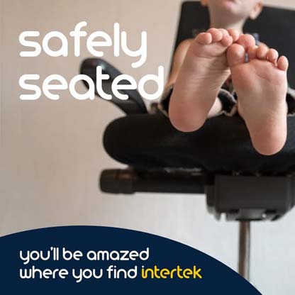 A view of the bare feet of a young child sitting in a chair